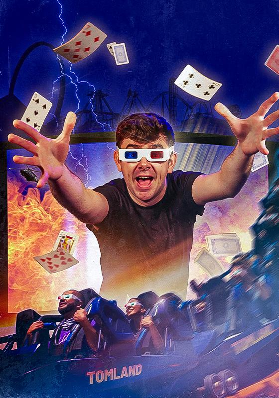 The performer wears 3D glasses and reaches his arms out. Cards are flying around in the background, and there is a rollercoaster at the bottom.