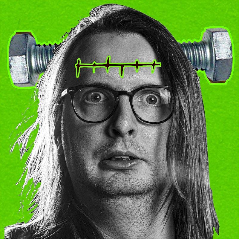 A black and white image of a performer on a green background. A screw is coming out their head and they have a green scar on their forehead. 